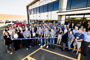 Ribbon cutting ceremony celebrating Sputtering Components' 25th anniversary and new facility expansion in Owatonna, Minnesota.