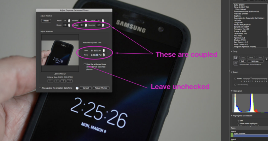 Smartphone digital clock used to synchronize camera time before importing photos into Photo Mechanic for accurate timestamps.